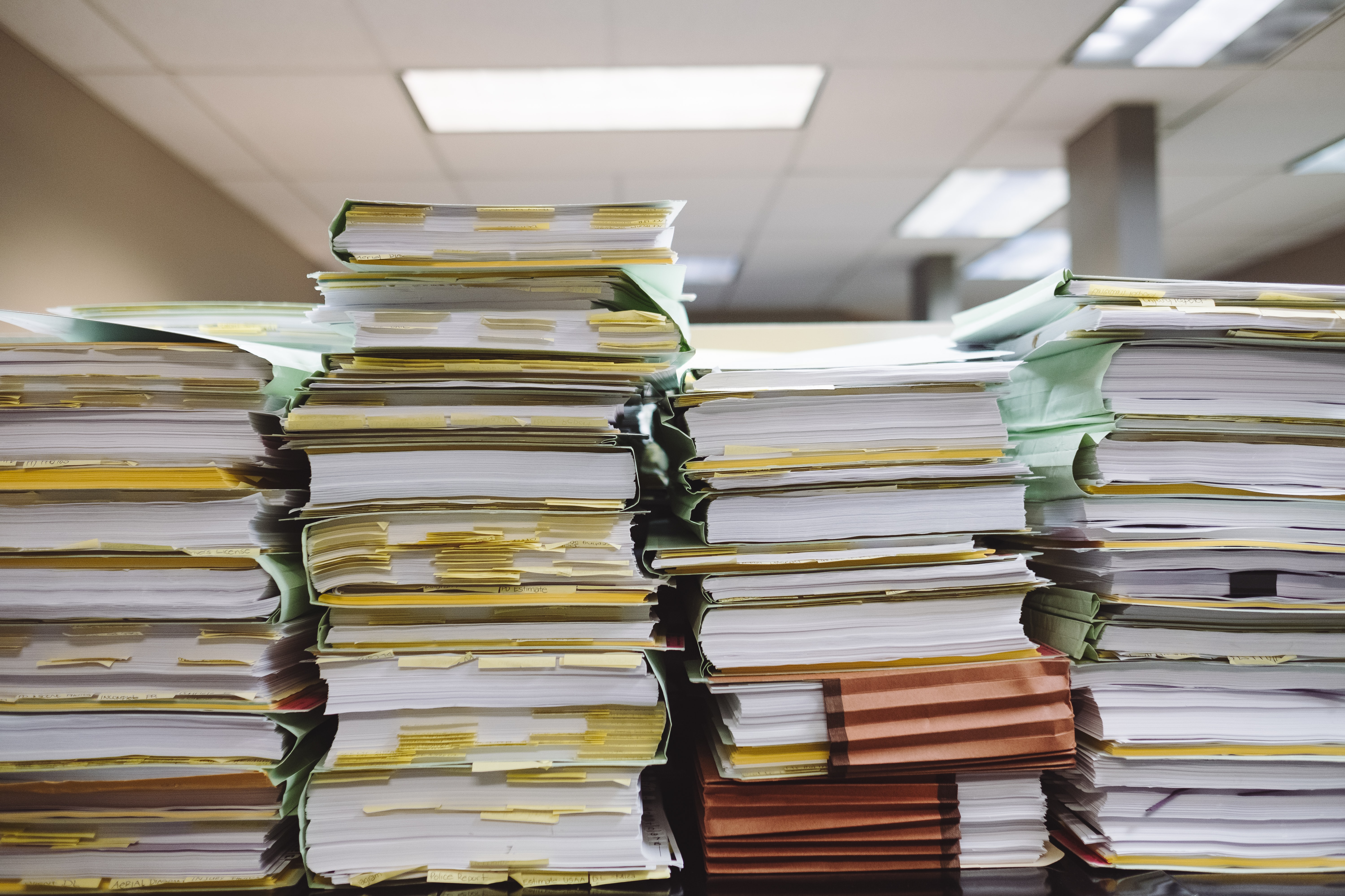 Stacks of files on a desk